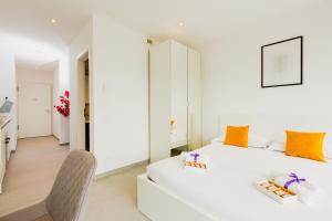 Letto o letti in una camera di Campus Lugano 45 wonderful Smart Suites in the university area