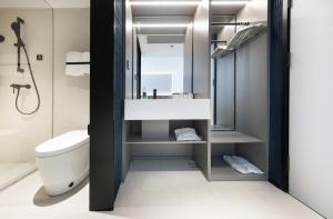 a bathroom with a white toilet and a sink at Atour Light Hotel Shenzhen North Station East Plaza in Lung Wa +20 photos