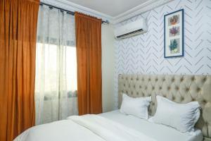 Postel nebo postele na pokoji v ubytování KK Lodging Yaounde Fouda