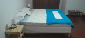 Postel nebo postele na pokoji v ubytování Villa Calhau + 15 fotografií