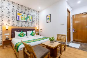 Rúm í herbergi á Treebo Anand The Mall Solan +30 myndir