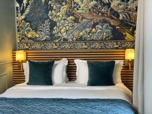 Boutique Hôtel Château Beaupin Restaurant & Wellness客房内的一张或多张床位