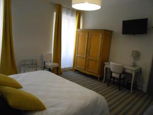 Postel nebo postele na pokoji v ubytování Régina Boutique Hotel