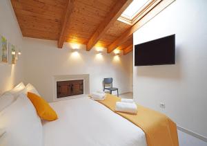 Televisyen dan/atau pusat hiburan di Sa Madalena Rooms And Apartments