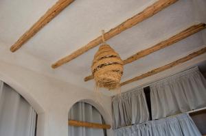 a basket hanging from a ceiling in a room at SurfAppart Morocco in Tamraght Ouzdar