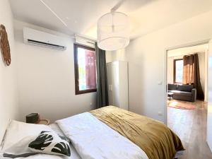 En eller flere senge i et værelse på M113 Marquer Superbe T2 proche de la douane Moillesulaz et de Genève