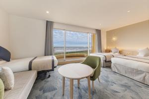 Postel nebo postele na pokoji v ubytování KAMENOI HOTEL Kujukuri