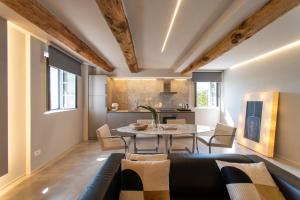 a dining room and kitchen with a table and chairs at Palazzo del Papa Country Suites-5 mins from Siena & Chianti Views in Siena