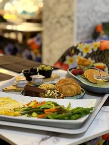 a table with plates of food on a table at Maarif elite suites in Casablanca