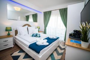 Postel nebo postele na pokoji v ubytování Club Waves - Vama Veche