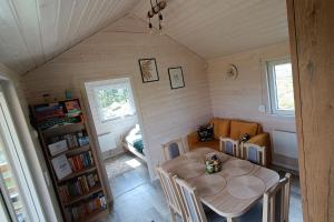 a dining room with a table and chairs in a room at Arkadia Borzestowo in Borzestowo +54 photos