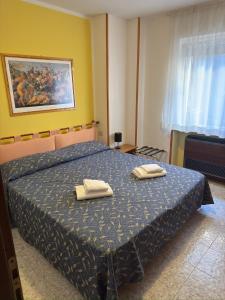 Postel nebo postele na pokoji v ubytování Hotel Benacus