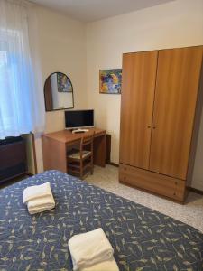 Postel nebo postele na pokoji v ubytování Hotel Benacus