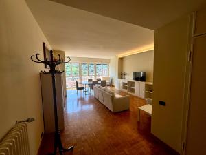 a living room with a couch and a table at Art & Lake Apartment in Lecco
