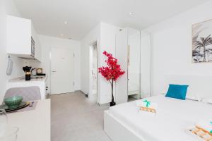 Letto o letti in una camera di Campus Lugano 45 wonderful Smart Suites in the university area