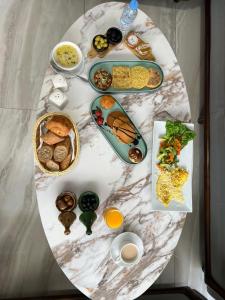 a round table with plates of food on it at Maarif elite suites in Casablanca