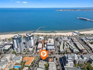 an aerial view of a city next to the beach at Port Paradiso in Melbourne