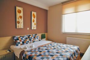 Postel nebo postele na pokoji v ubytování Hotel Bulevar