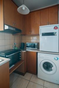 Η κουζίνα ή μικρή κουζίνα στο Iriana's Home +4 φωτογραφίες