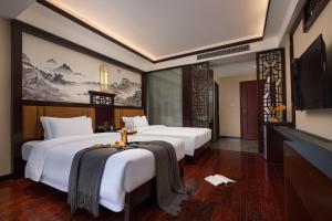 Ancient Dream Hotel客房内的一张或多张床位