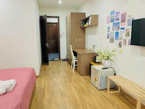a bedroom with a desk and a bed and a desk at Pina Home in Da Nang +13 photos