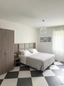 Postel nebo postele na pokoji v ubytování Cà Masawalsa Hotel