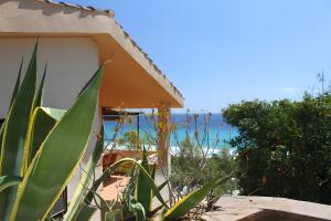 a house with a view of the ocean at Nido 3 in Costa Rei +10 photos