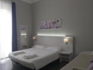 Postel nebo postele na pokoji v ubytování Lodges le Mura