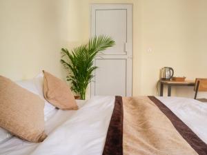 Katil atau katil-katil dalam bilik di Zen Nest Hotel