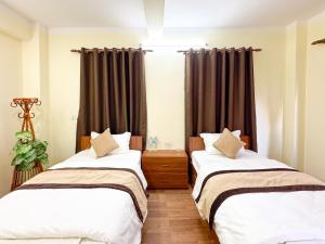 Katil atau katil-katil dalam bilik di Zen Nest Hotel