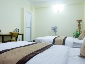Katil atau katil-katil dalam bilik di Zen Nest Hotel