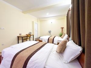 Katil atau katil-katil dalam bilik di Zen Nest Hotel