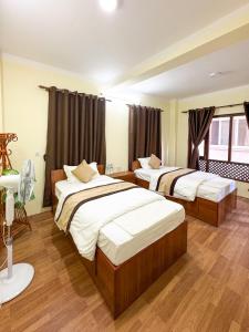 Katil atau katil-katil dalam bilik di Zen Nest Hotel