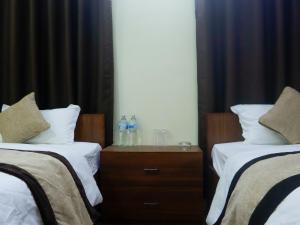 Katil atau katil-katil dalam bilik di Zen Nest Hotel