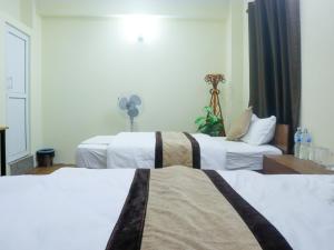Katil atau katil-katil dalam bilik di Zen Nest Hotel