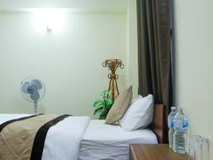 Katil atau katil-katil dalam bilik di Zen Nest Hotel