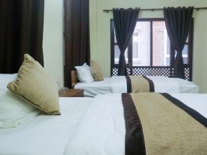 Katil atau katil-katil dalam bilik di Zen Nest Hotel