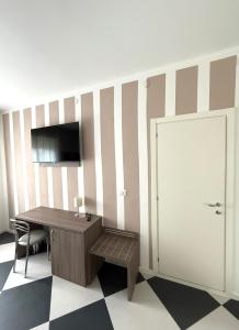 TV a/nebo společenská místnost v ubytování Cà Masawalsa Hotel