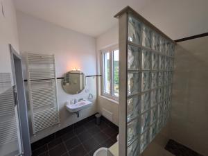 a bathroom with a sink and a mirror at La casa di nonna in Montesano sulla Marcellana