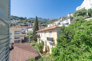 a view of a city with buildings and trees at SUITE DELUXE - MONACO - Vue Jardin in Beausoleil