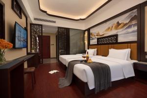 Ancient Dream Hotel客房内的一张或多张床位
