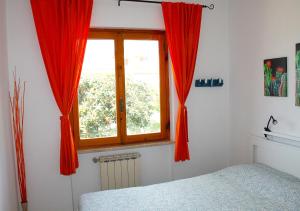 A bed or beds in a room at Casa ViDa Sabaudia