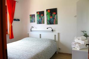 A bed or beds in a room at Casa ViDa Sabaudia