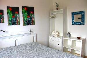 A bed or beds in a room at Casa ViDa Sabaudia
