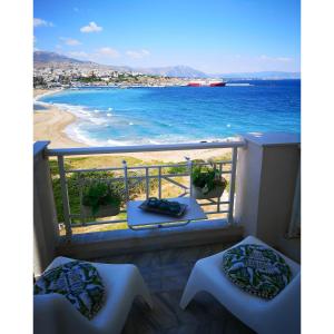 a balcony with a view of the beach at Little gem in Rafina