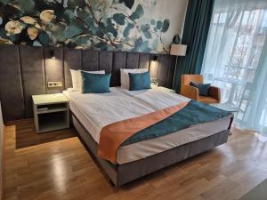 Postel nebo postele na pokoji v ubytování Szépia Bio and Art Hotel