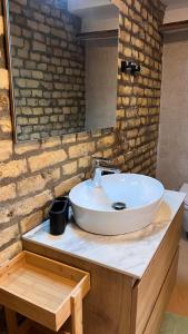 a bathroom with a white sink on a counter at Villa Mediterrane - Apartment Bologne in Frankenthal +59 photos