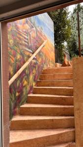 a painting of a staircase with a mural at Villa Mediterrane - Apartment Bologne in Frankenthal