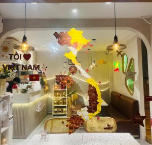 a shop window with a colorful depiction of a chinese at Góc Hải Phòng Drinks & Homestay Q4 in Ho Chi Minh City
