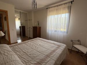 Postel nebo postele na pokoji v ubytování Apartamentos Vacacionales Atlanterra